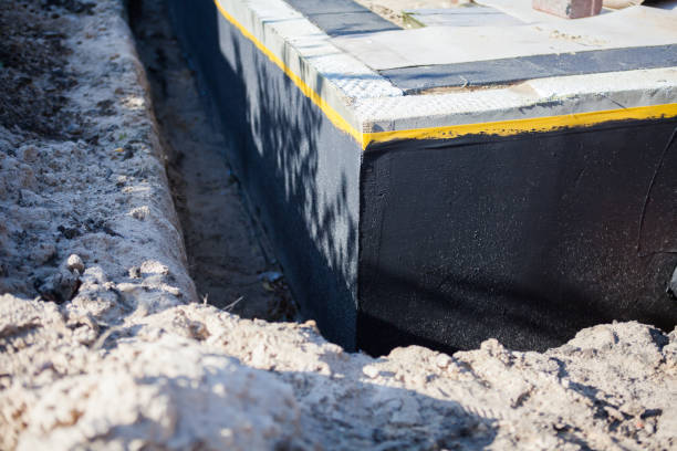 Professional Waterproofing technician working in Pleasant Lake, MI